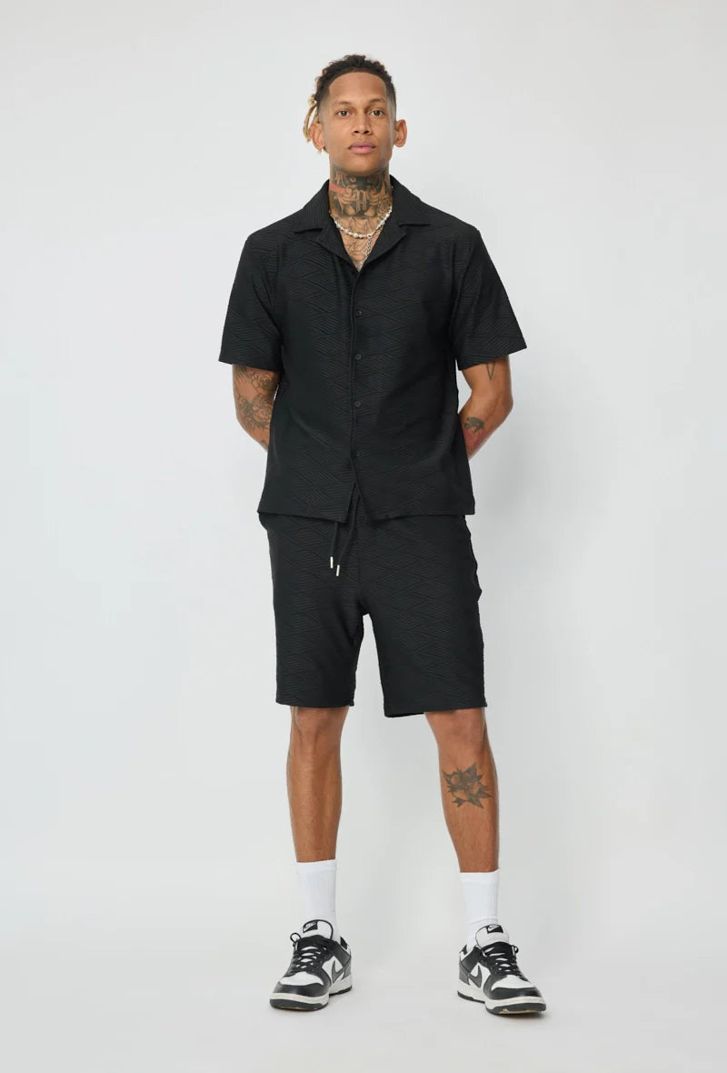 Set van effen shirt en korte broek met patroon