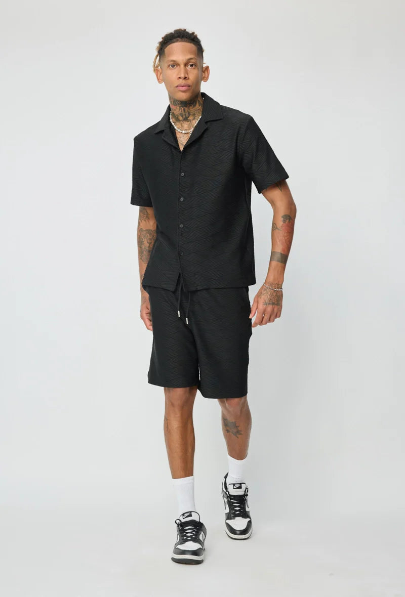 Set van effen shirt en korte broek met patroon