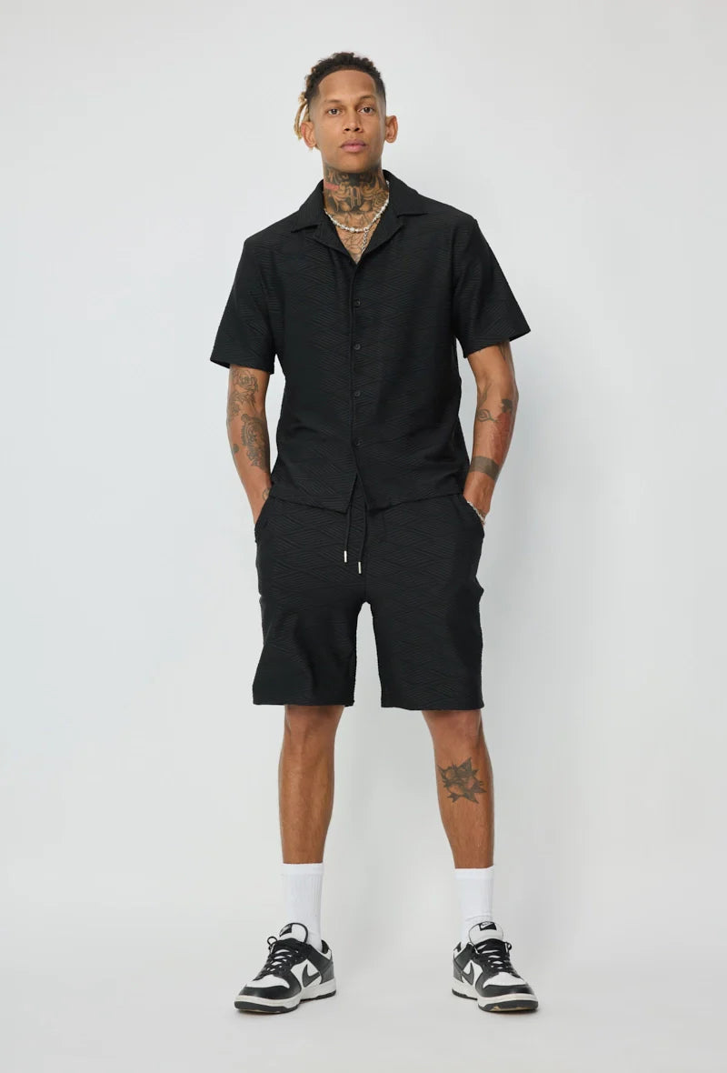 Set van effen shirt en korte broek met patroon